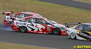 Mark Skaife is tipped into a spin by HRT teammate Todd Kelly