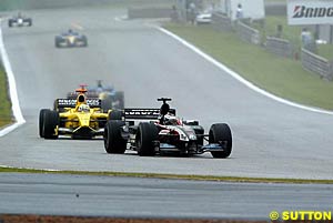 Jos Verstappen running ahead of eventual race winner Giancarlo Fisichella in the 2003 Grand Prix of Brazil