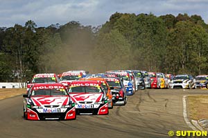 Todd Kelly leads teammate Mark Skaife at the start of race one
