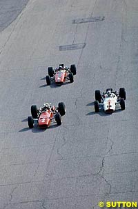 The Ferrari 312 of Chris Amon leads John Surtees in the Honda RA3000, 1967 Italian Grand Prix at Monza