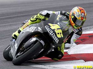 Valentino Rossi round a bend as he tests his Yamaha M1 at Sepang