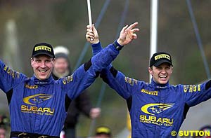 Phil Mills and Petter Solber celebrate after wrapping up last year's title with a win at the 2003 Rally GB