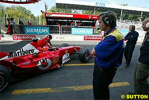 Michelin engineer observes the Ferrari at Monza testing