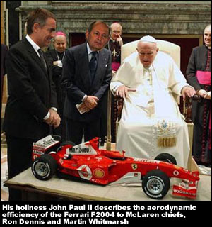 His holiness John Paul II describes the aerodynamic efficiency of the Ferrari F2004 to McLaren's Ron Dennis and Martin Whitmarsh