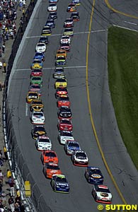 Dale Jarrett and Jimmie Johnson lead the field away at the start