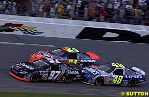 Kurt Busch battles with Hendrick teammates Jeff Gordon and Jimmie Johnson