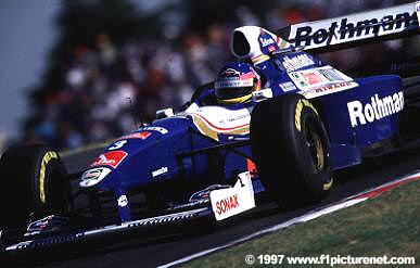 Villeneuve hangs on to win.