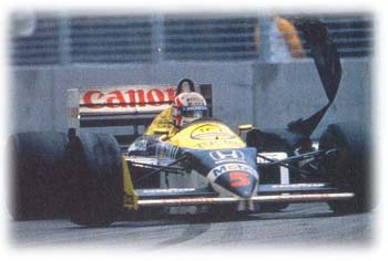 Nigel Mansell blows a tyre