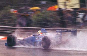 Gachot battles the rain in the 89 Belgian GP