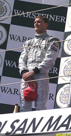 Dave Coulthard ponders on the podium