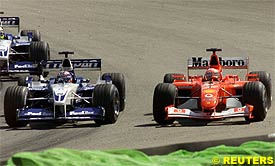 Michael Schumacher passes Montoya