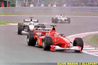 Schumacher leads from Hakkinen and brother Ralf