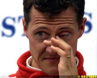 Schumacher wipes his eye on the podium